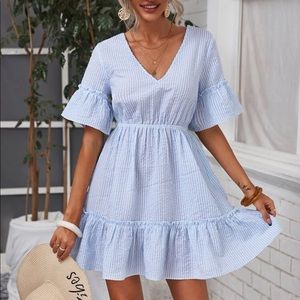 Striped flouncy dress. Open back.